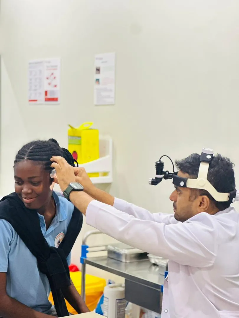 Child receiving hearing check-up